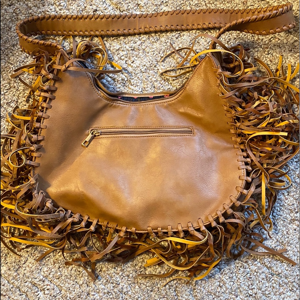 Tan hobo purse with tassels.  $15